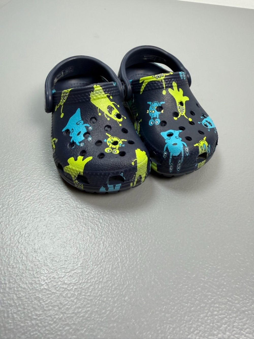 Boys Toddler Crocs size 5 Classic monster print clogs blue Excellent Condition
